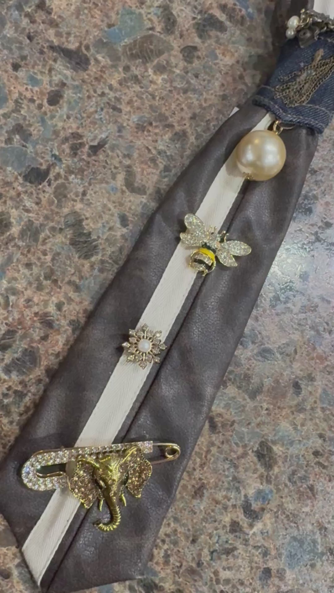 Brown faux leather tie with charms
