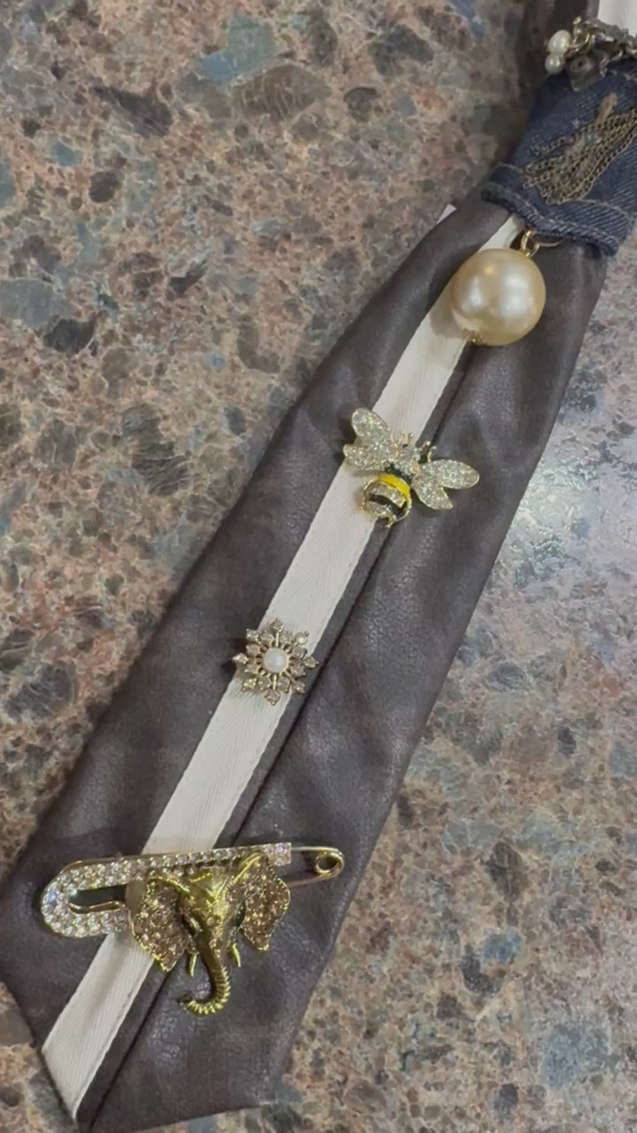 Brown faux leather tie with charms